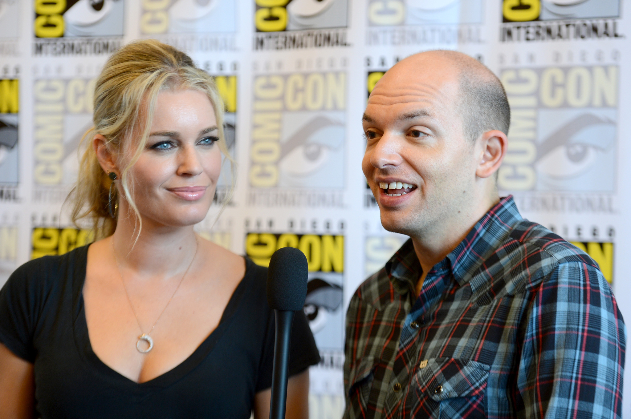Rebecca Romijn and Paul Scheer at event of NTSF:SD:SUV (2011)