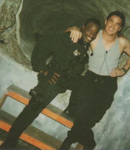 Grand L. Bush and Dean Cain pose for the continuity department in front of an 