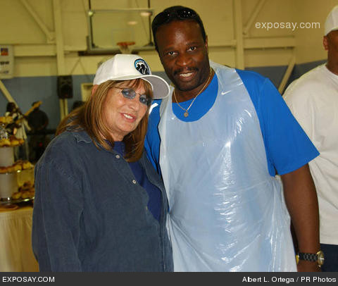 Grand L. Bush and actor/director Penny Marshall pose for photos after helping the Mark Wahlberg Youth Foundation serve hundreds of needy families in Watts, CA, a hearty Thanksgiving dinner with all the trimmings.