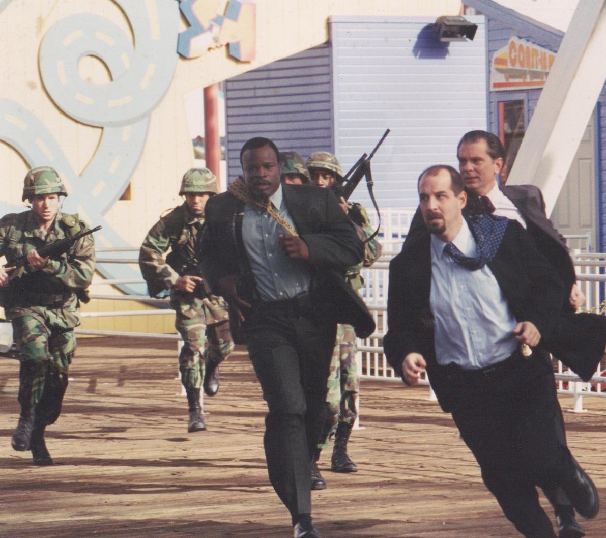 Grand L. Bush, John Storey and Leon Rippy sprint the length of the Santa Monica Pier in a scene from THE VISITOR. There were more than six exhaustive takes before the director finally yelled, 