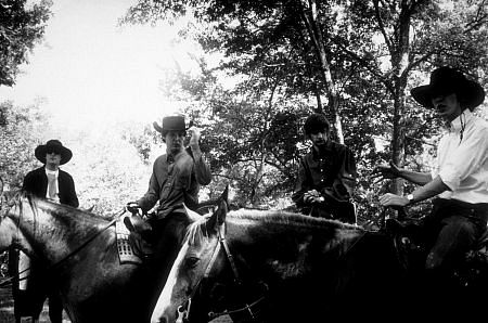 The Beatles (John Lennon, Paul McCartney, Ringo Starr, & George Harrison) on horseback in Ozarks, Arkansas, c. 1965