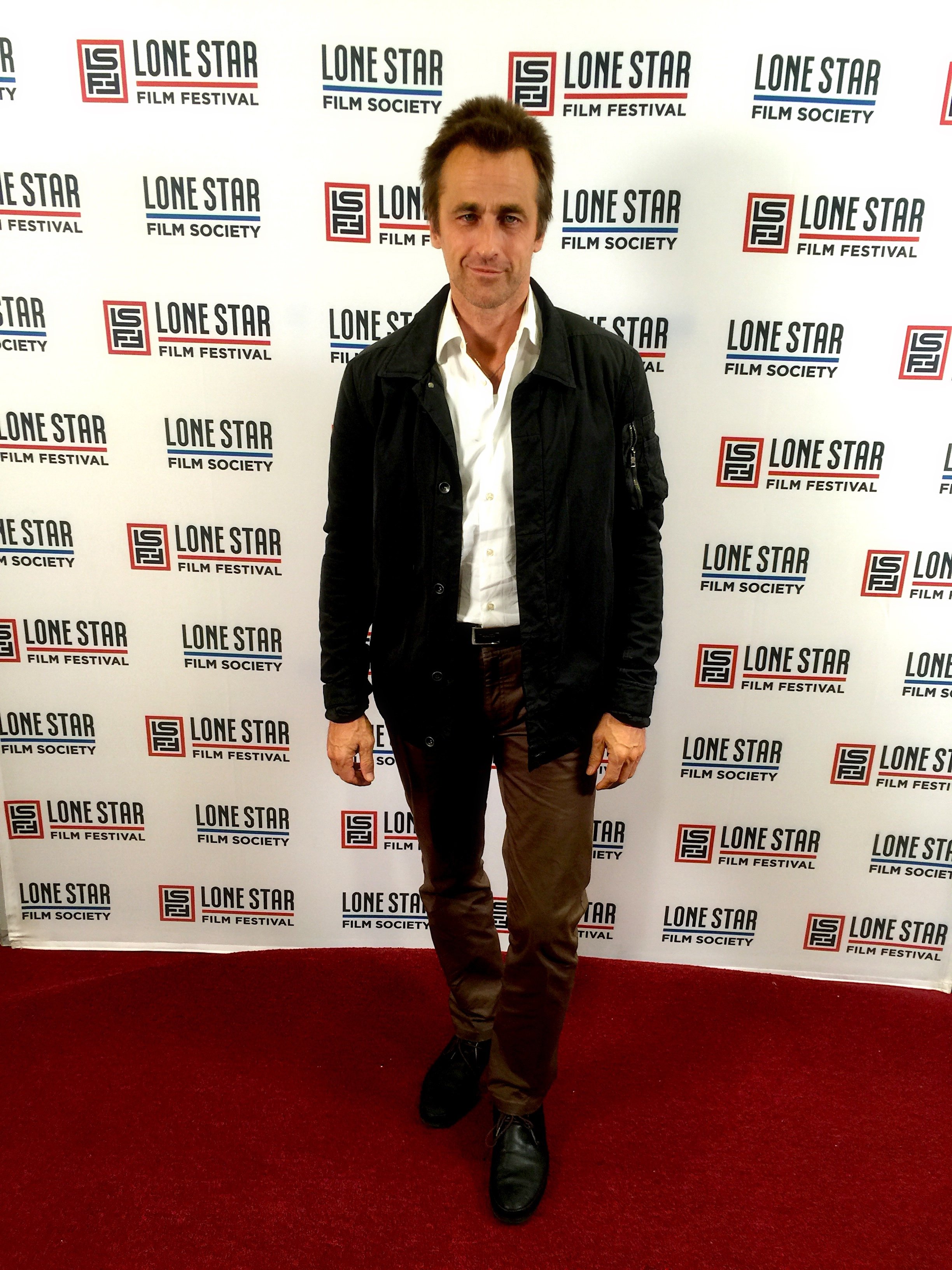 Crispian Belfrage on the carpet at the Texas Premier of 