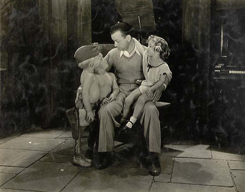 Director Charles Lamont talking to Shirley Temple, George Smith and unknown on the set of 