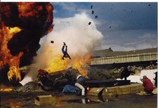 Marc Cass performing an Air Ram Stunt over an Exploding Car for a newspaper story.