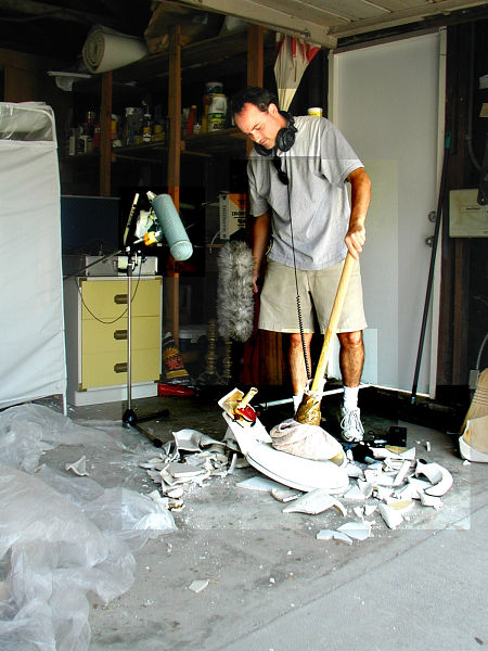 Yann Delpuech breaking a toilet with a sledge hammer for Dreamcatcher.