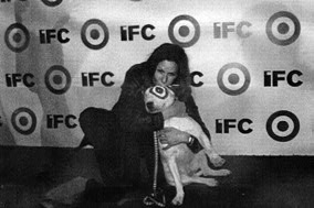 Mary Aloe on the red carpet with the IFC mascot after the Independent Spirit Awards