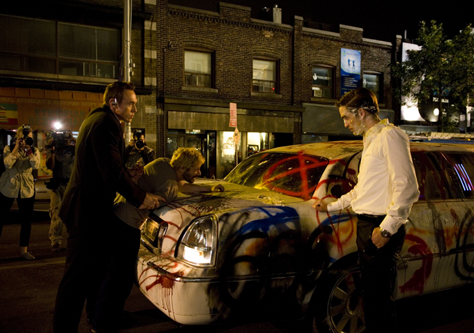 Still of Mathieu Amalric and Robert Pattinson in Kosmopolis (2012)