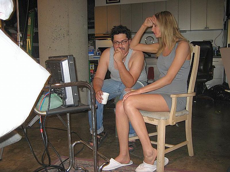 Actress Amy Rasimas and Carlos Antonio watch themselves on the playback while shooting ID (Intelligent Design).