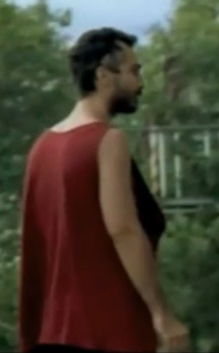 Still of Michael Aronov (nearly 50 lbs. thinner) as drug-addled 