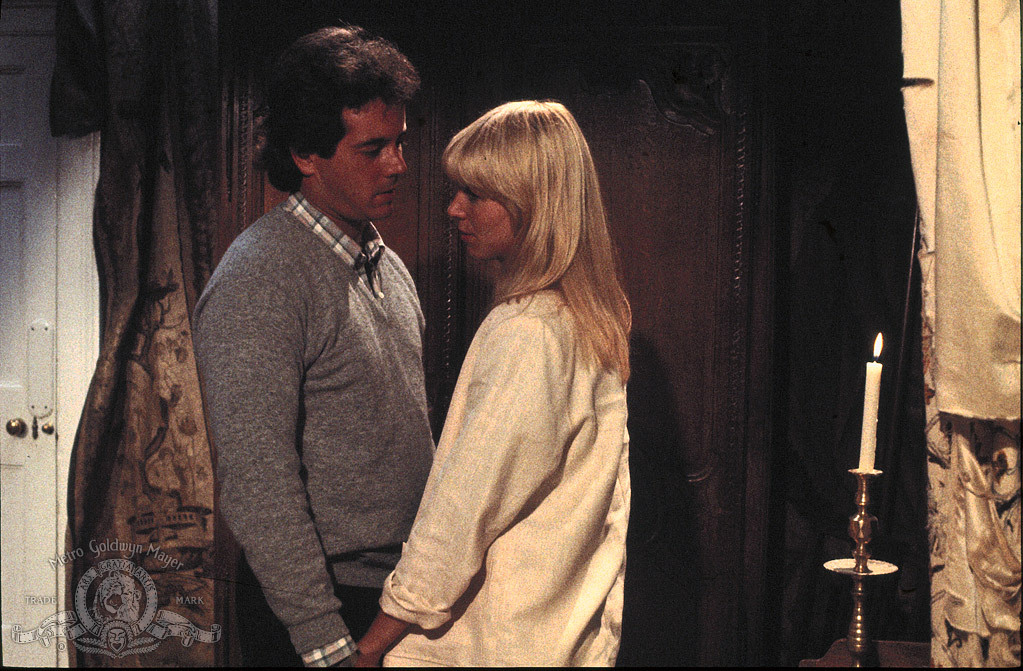 Still of Desi Arnaz Jr. and Julie Peasgood in House of the Long Shadows (1983)