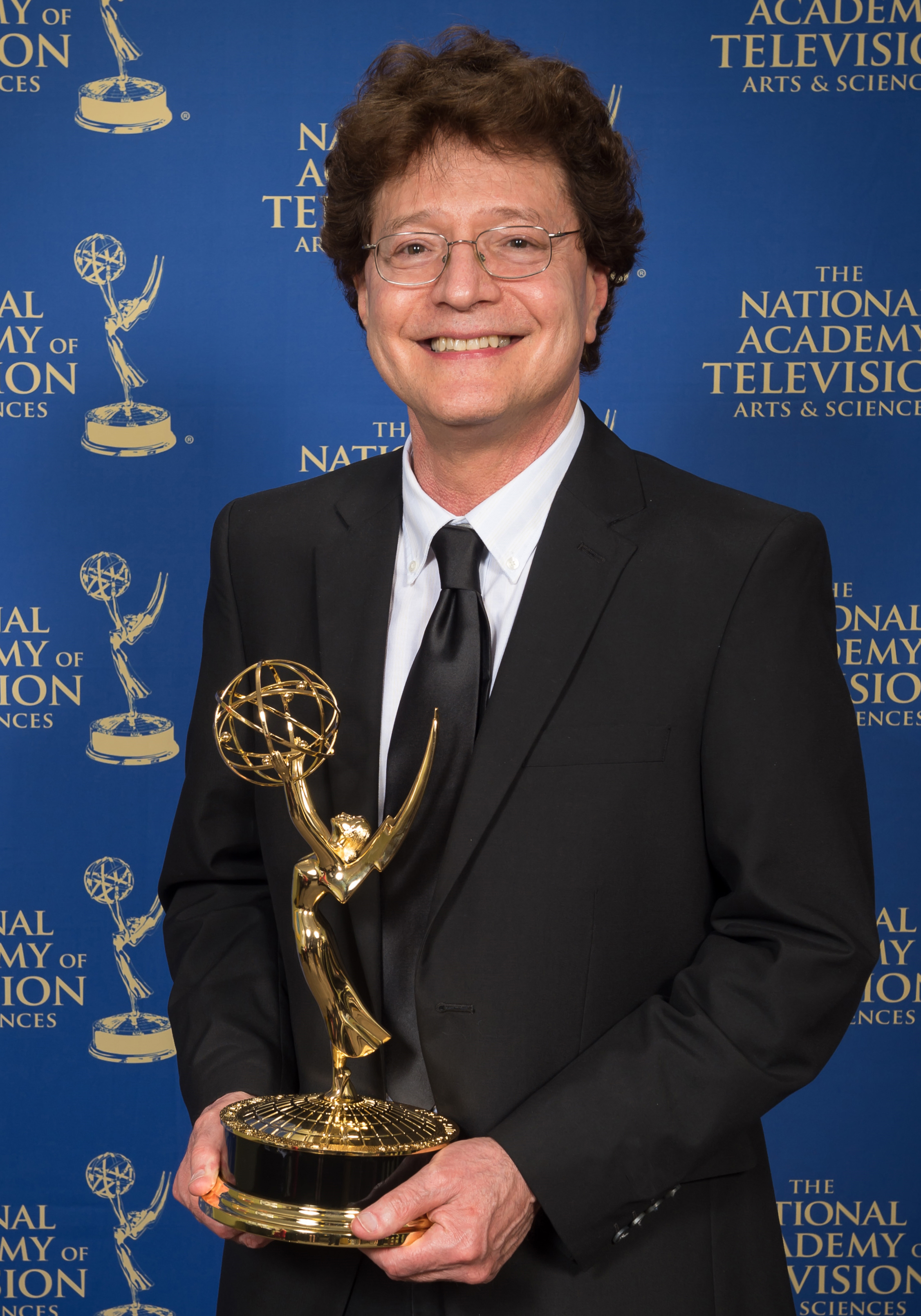 Jerry Aronson receiving Emmy Award for CHASING ICE in the 