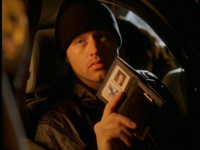 Sergei Malatov (Chris Ashworth) presents his fake credentials to get past security in order to kidnap the engineer, in Season 2.