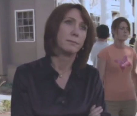 Carol Avery reacting to her neighbor's murder on Nip/Tuck.
