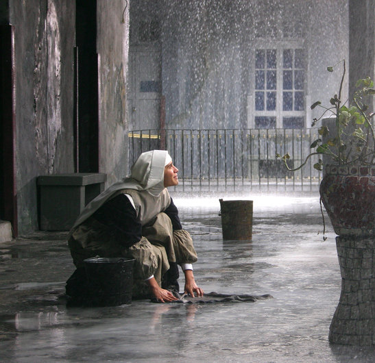 Matilde praying for the rain to stop