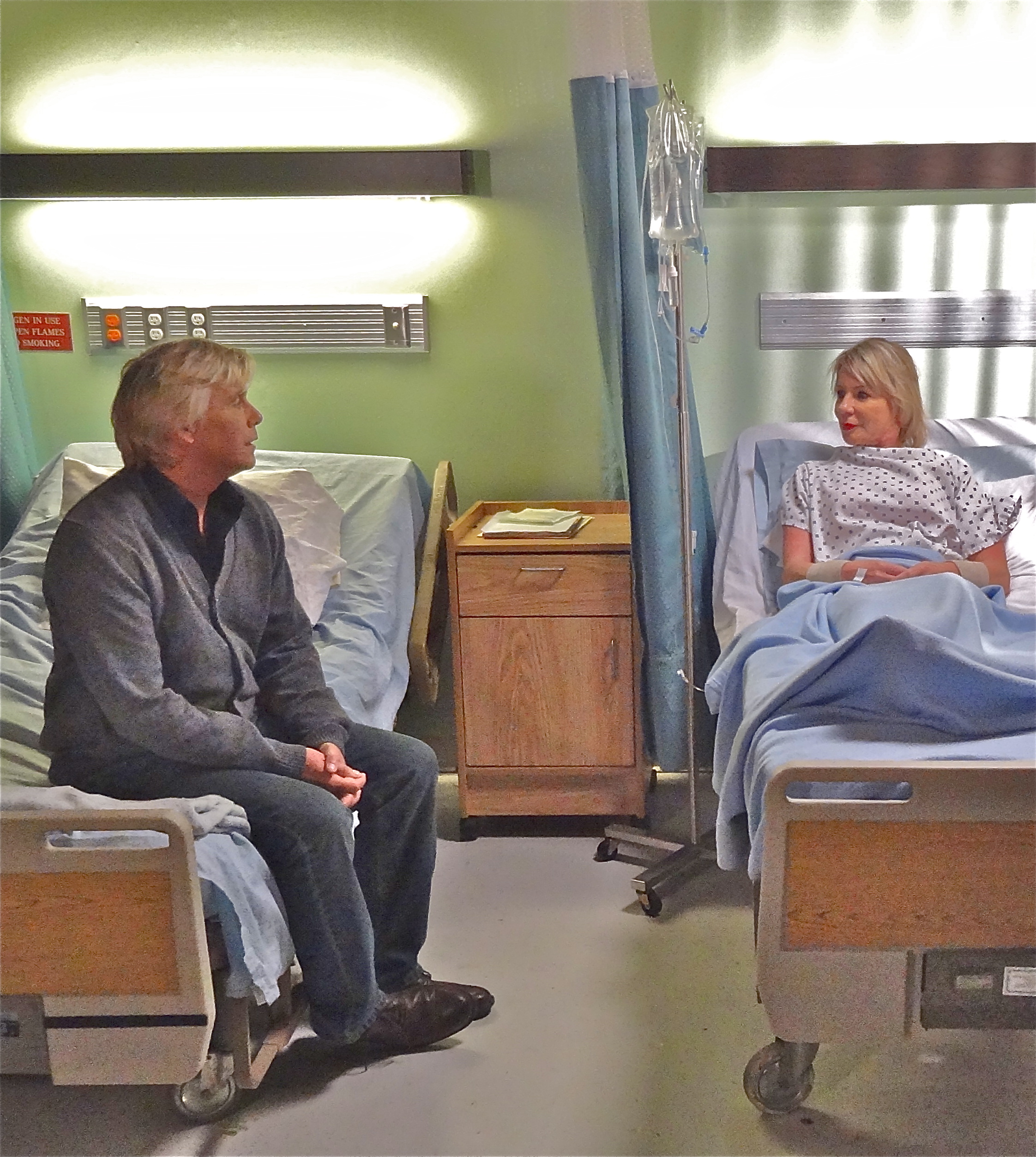 Henry (Christopher Atkins) visiting his wife, Ellen (Kandra King) in the hospital during the filming of the feature film, Lake of Fire, 2014.
