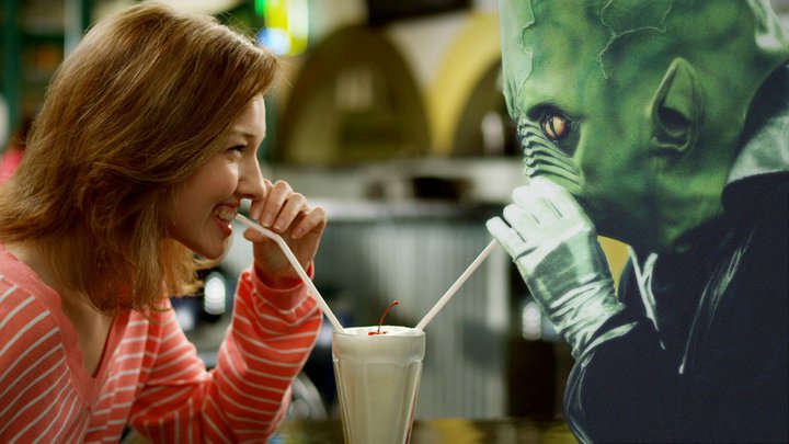 alien and girl drinking a milkshake