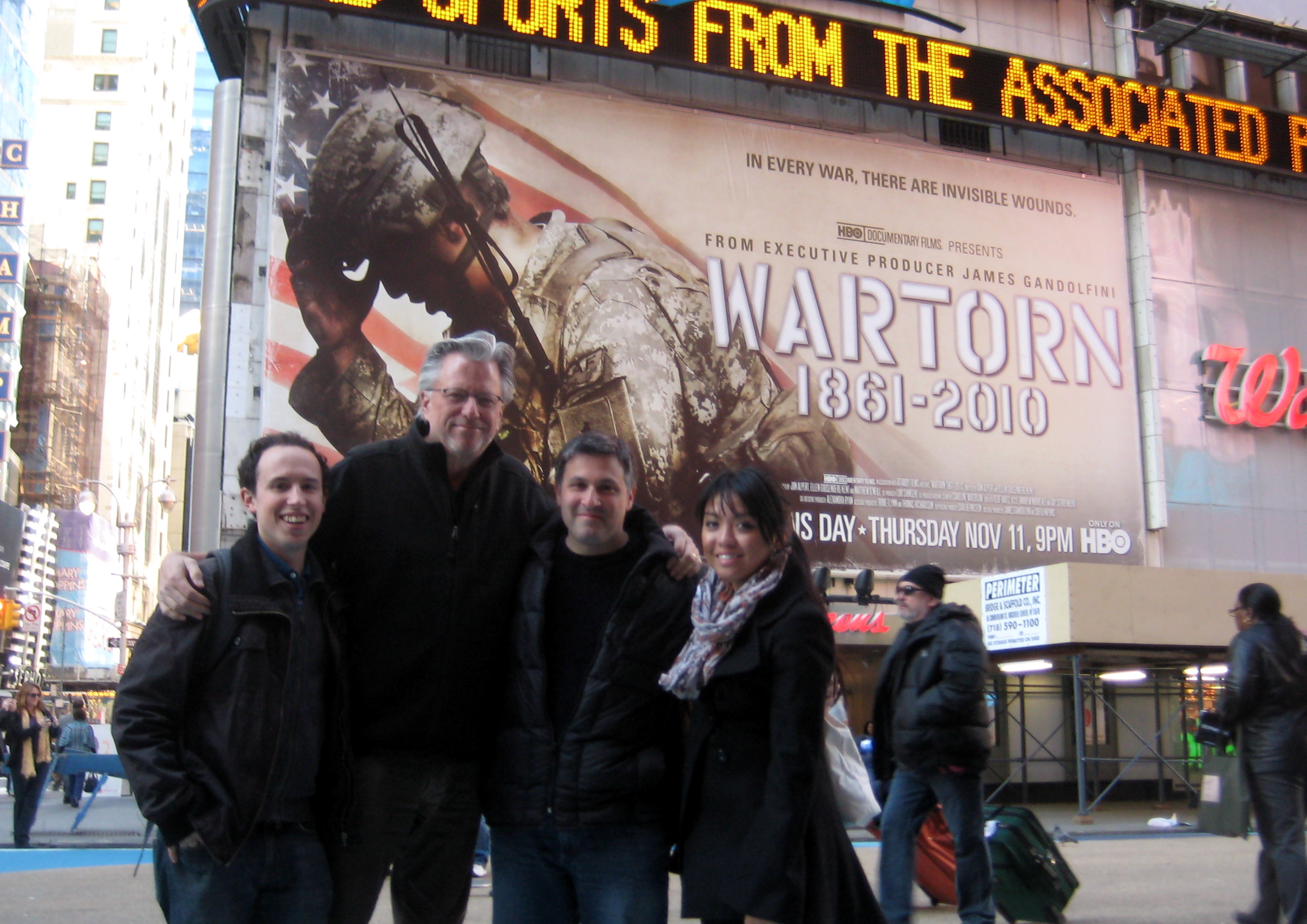 Jay Sterrenberg,Geof Bartz, Andy Morreale,Gladys Murphy in front of WARTORN poster in Times Square, November 2010