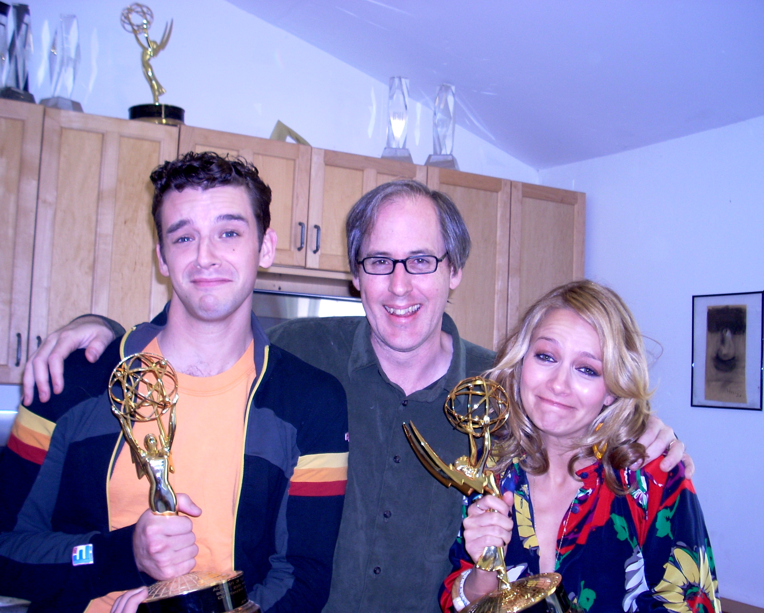 Michael Urie and Becki Newton of Ugly Betty hold a couple of Jeff Beal's Emmy Awards.