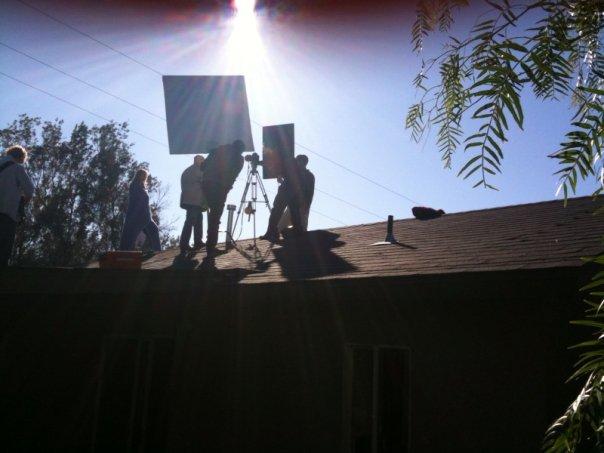 Ashley Hinson (as Janice) and Dave Bean (as Det. Les Strade) prepare for a rooftop shot in thriller 