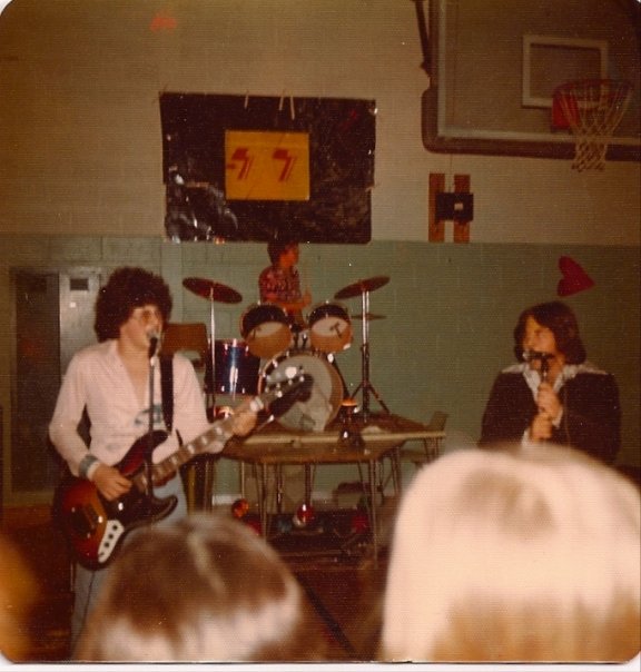 In his youth, Dave Bean (on right, w/wide collar, thick head of hair...) was lead vocalist for Detroit garage band Sash. Bass player on left is Randy Sosin, now VP of Talent for MTV.