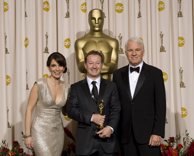 Academy Award®-winner Simon Beaufoy (center) with presenters (left to right) Tina Faye and Steve Martin backstage at the 81st Academy Awards® are presented live on the ABC Television network from The Kodak Theatre in Hollywood, CA, Sunday, February 22, 2009.
