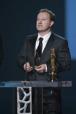 Simon Beaufoy accepts the Oscar® for Writing (Adapted Screenplay) for 