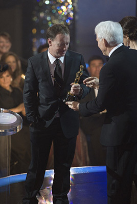 Simon Beaufoy accepts the Oscar® for Writing (Adapted Screenplay) for 