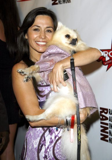 Yeniffer Behrens arrives at the Rock Your Fashion Awards with a furry friend