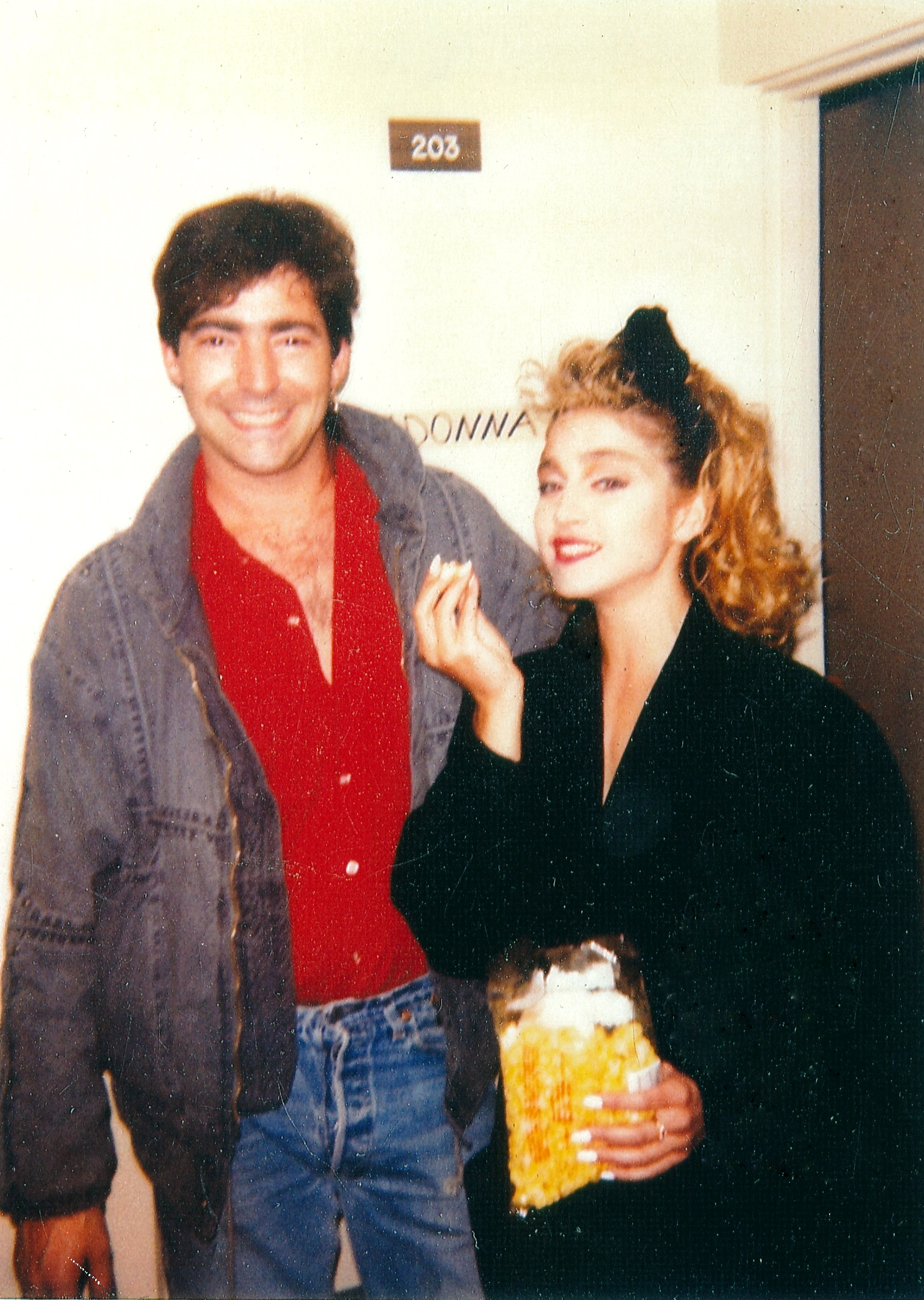 Madonna & Me eating popcorn in her dressing room. I also played a small part on Material Girl video. I'm the one with the wastepaper basket. We worked on several things including 