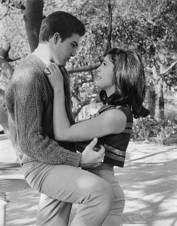 Paul Peterson with Brenda Benet on a swing c. 1965