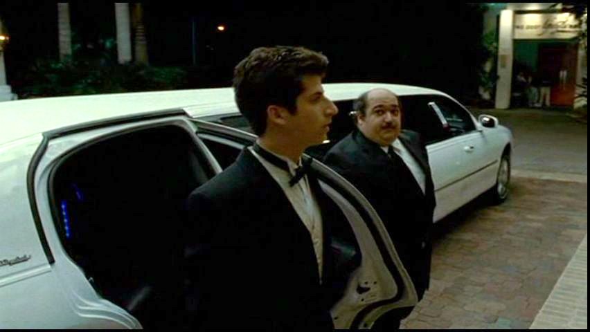 Mike Benitez as the Chauffeur from Bart Got A Room. Also shown is Steven Kaplan.