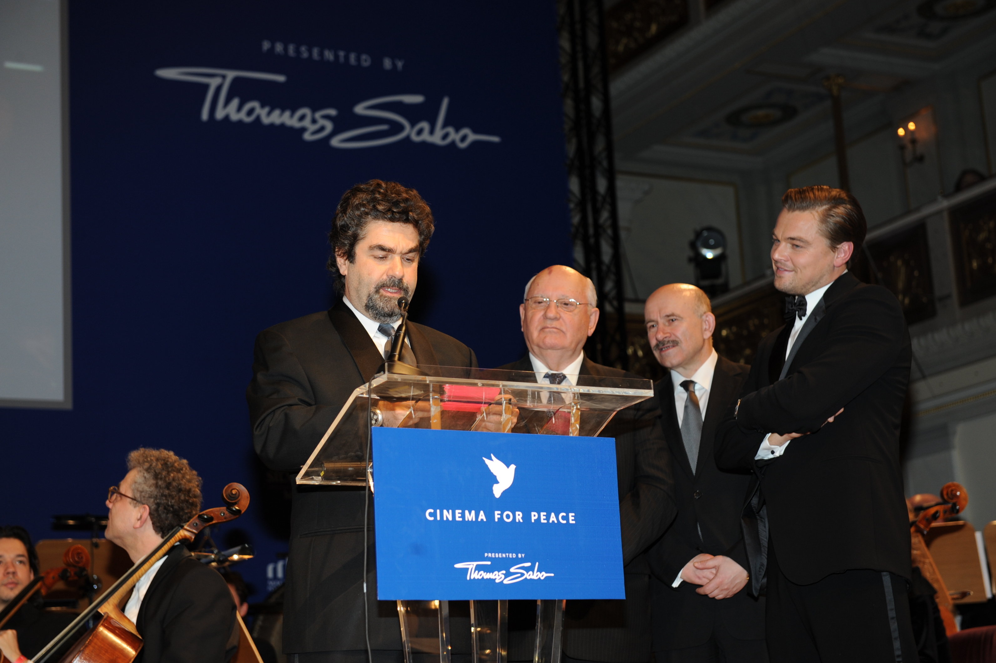 Joe Berlinger accepts the Cinema for Peace prize from Mikhail Gorbachev and Leonardo DiCaprio