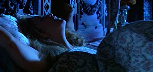 The actress, Greta Scacchi, moans in a love scene in The Manor, directed by Ken Berris