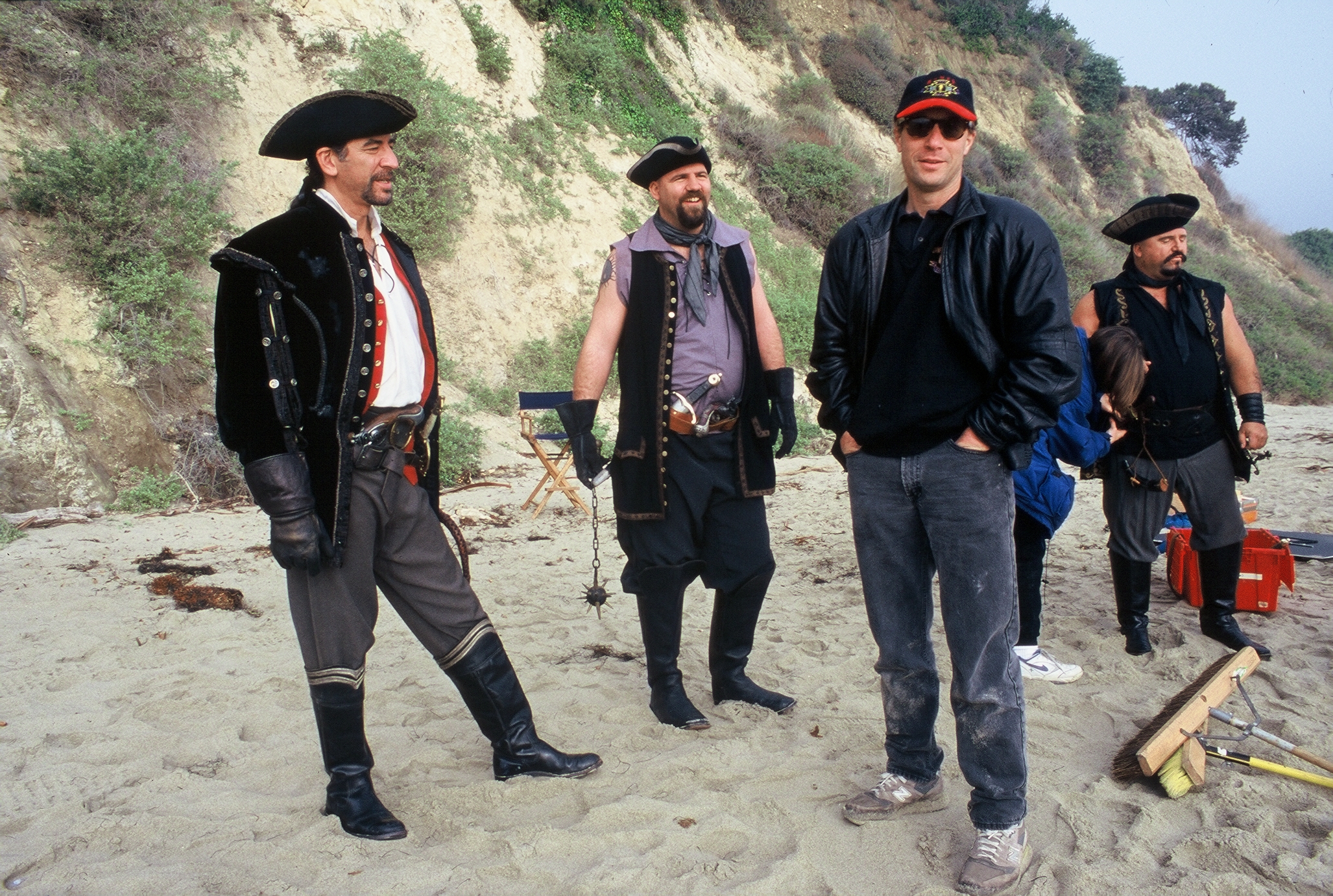Berris shares a laugh with Michael Gregory and his band of Pirates on a beach location.
