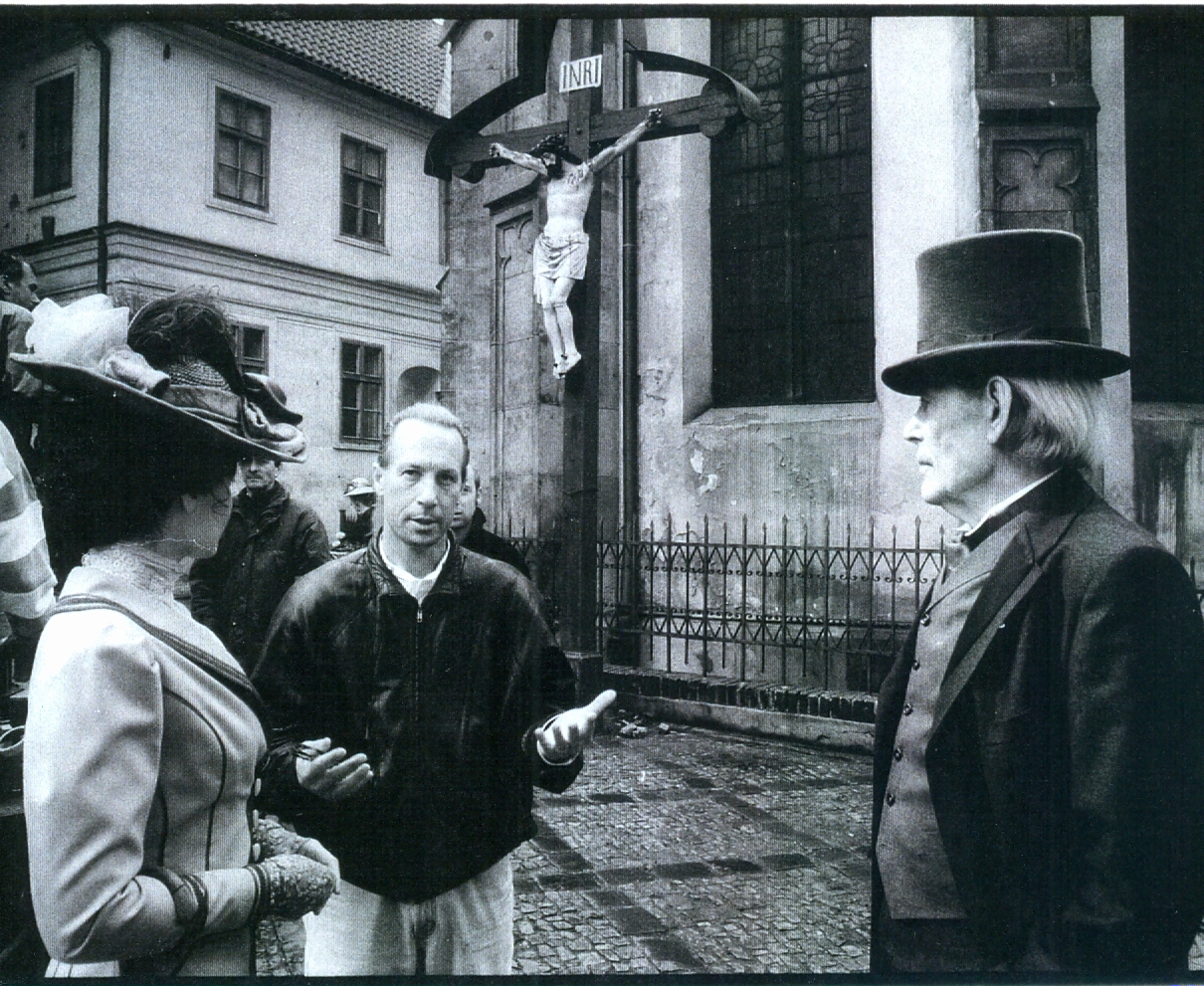 Ken Berris directs Gabrielle Anwar and Peter OToole on a European street set.