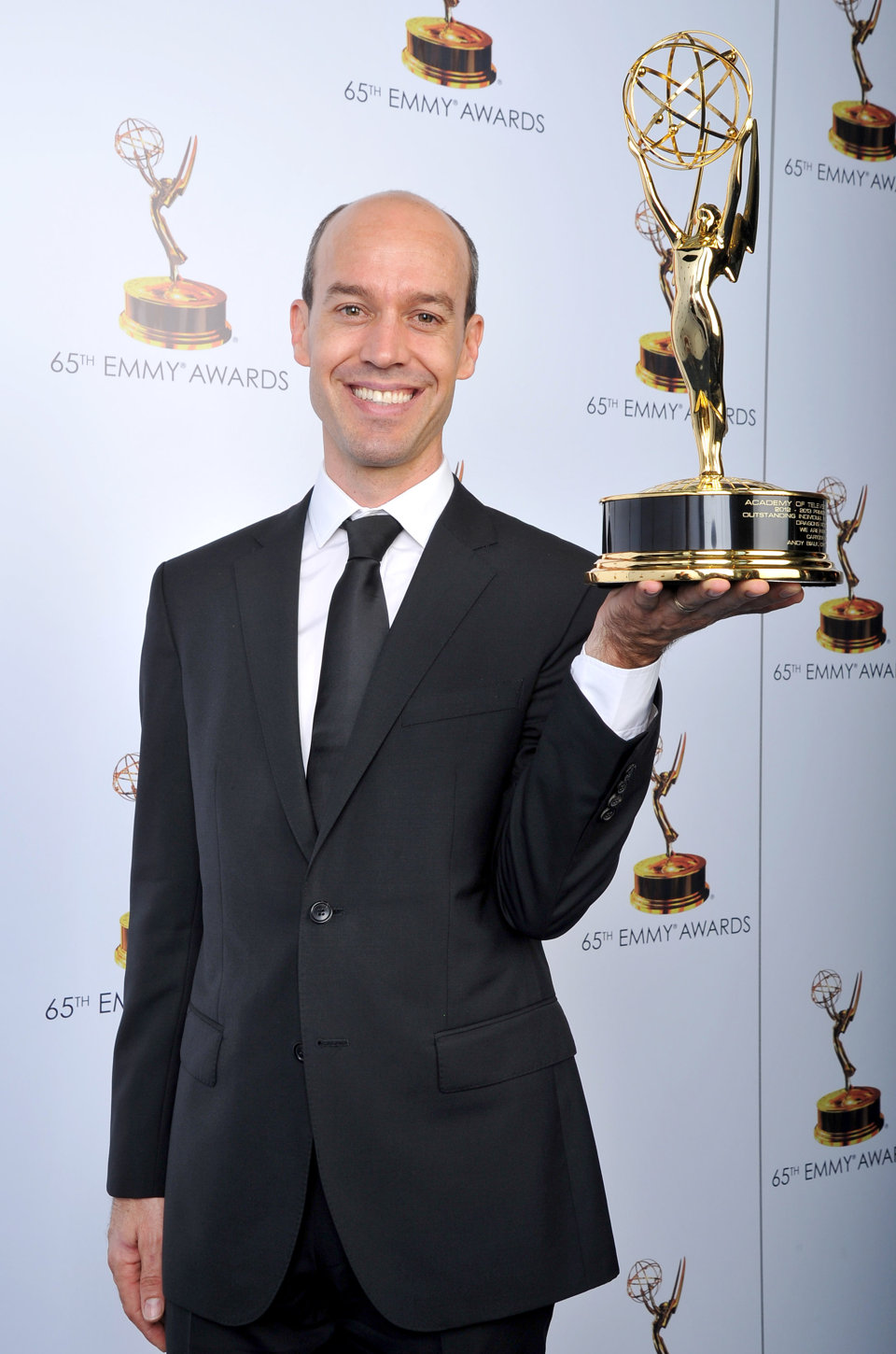 Andy Bialk poses with the award for Outstanding Individual Achievements in Animation for Dragons: Riders of Berk onstage at the 2013 Primetime Creative Arts Emmy Awards, on Sunday, September 15, 2013 at Nokia Theatre L.A. Live, in Los Angeles, Calif.