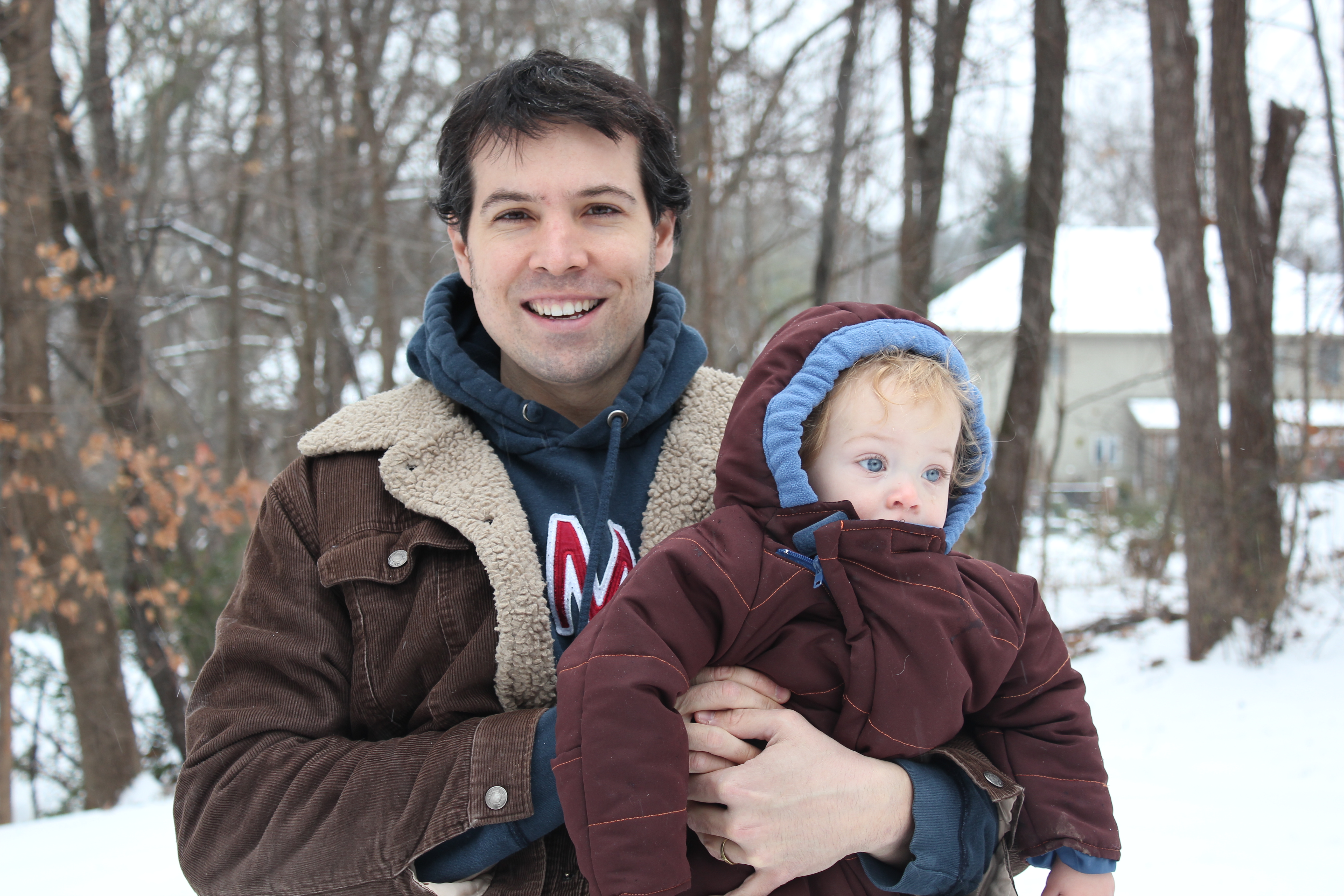 John outside his house in Virginia with his baby son Ivan Birmingham, December 2010.