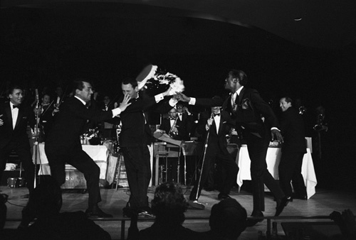 Peter Lawford, Dean Martin, Joey Bishop, Frank Sinatra, Sammy Davis Jr. and Buddy Lester performing in the Copa Room at the Sands Hotel in Las Vegas