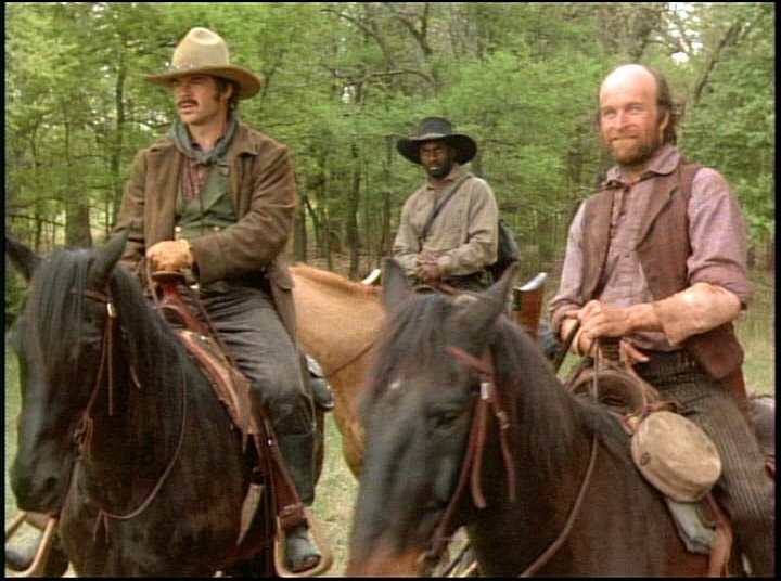 Robert Urich, Jerry Biggs, Luigi Borghese and Julius Tennon in Lonesome Dove (1989)