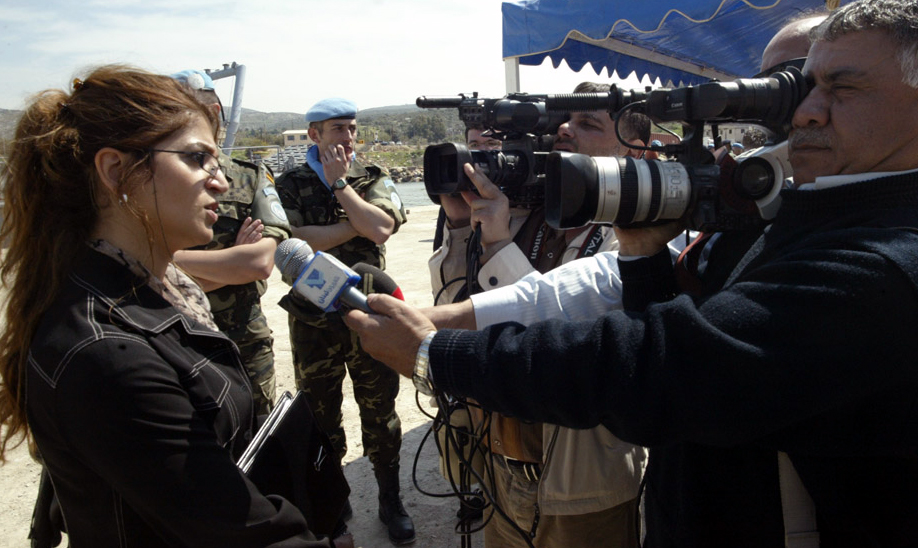 Yasmina Bouziane carrying out an interview with Lebanese television stations on location in South Lebanon