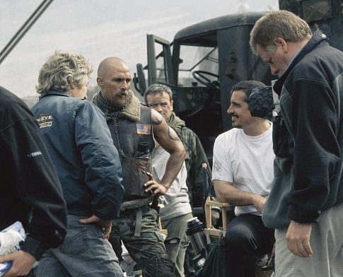 Matthew McConaughey (second from left) chats with the crew during a break in filming. Directed by Rob Bowman.