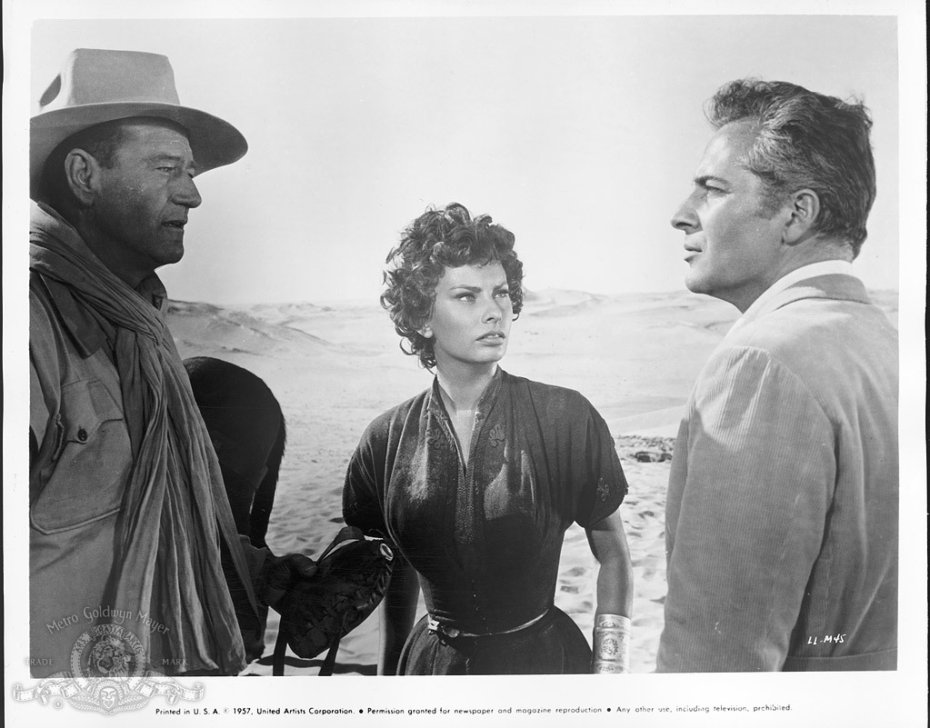 Still of Sophia Loren, John Wayne and Rossano Brazzi in Legend of the Lost (1957)