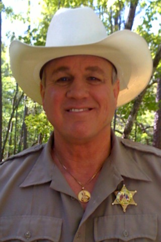 Reb Brown as 'Sheriff Kelly'