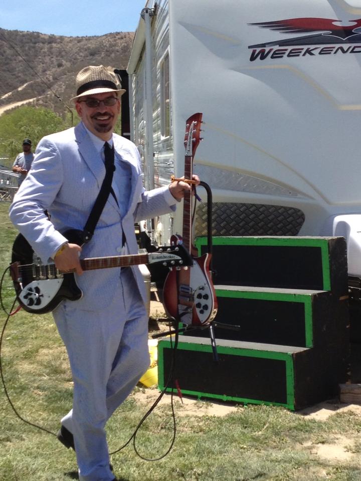 Sammy Busby of Dixie's Deceivers and his Rickenbacker guitars head for the stage in Temecula, California for the 