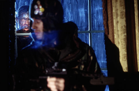 Marvin Campbell is the infected peering through the window at Luke Mably (front).