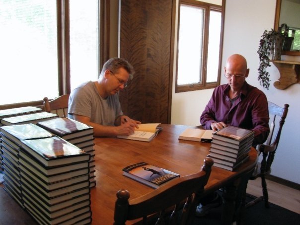 Don Caron and Lyle Hatcher signing Different Drummers books.