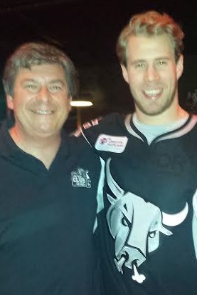 Tory Christopher with professional hockey player Corban Knight.