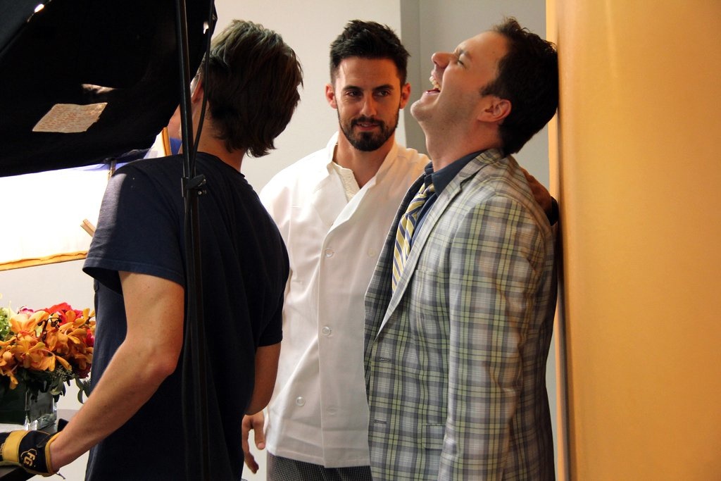 Behind the scenes still of Wilson Cleveland (Nick) and Milo Ventimiglia (Cook) on set of The Temp Life season 5.