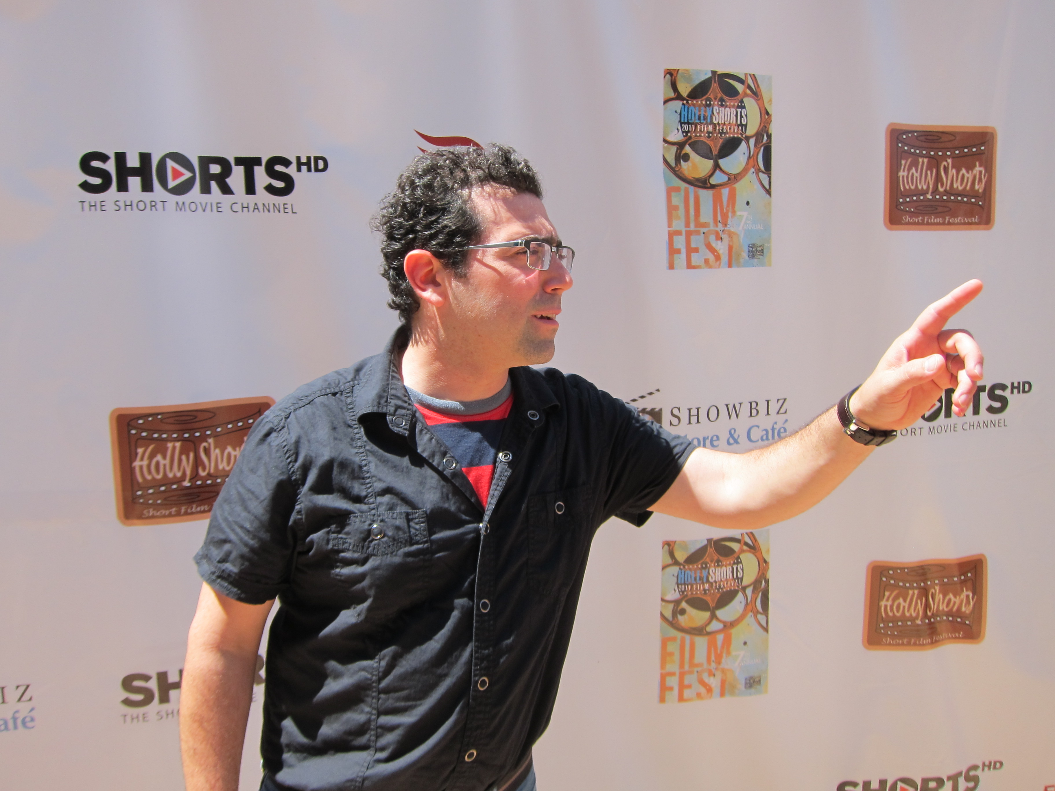 Bryan Coffee pointing on the red carpet of the Hollyshorts Film Festival 2011