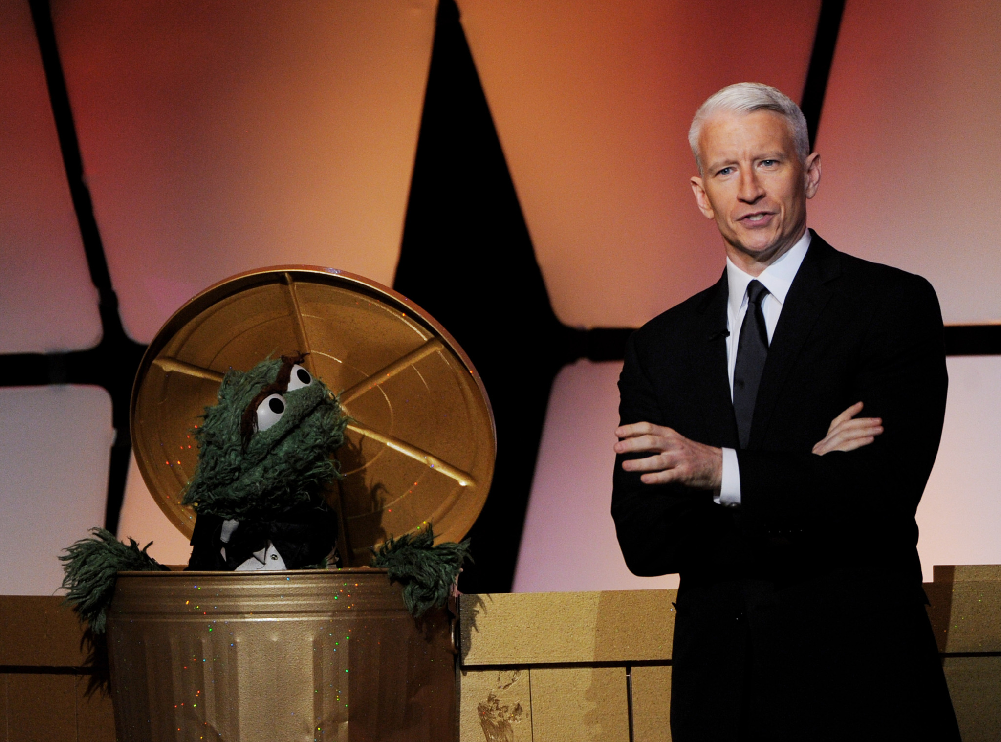 Oscar the Grouch and CNN anchor Anderson Cooper